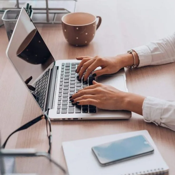 Professional working on documents and digital records